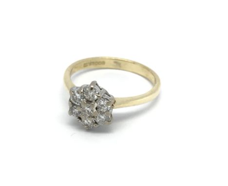 An 18carat gold diamond cluster ring. Size K.