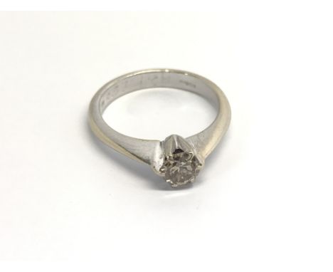 An 18carat white gold solitaire diamond ring with a cape diamond approximately 0.33 of a carat. ring size M-N