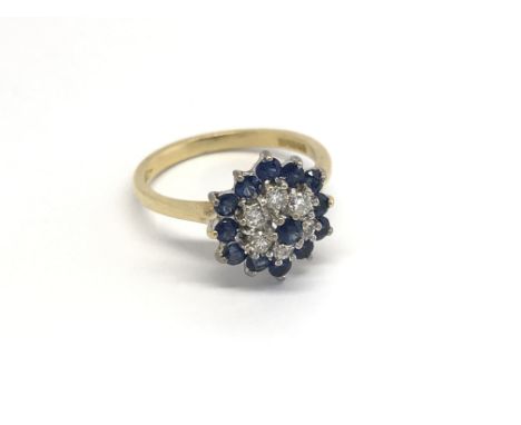 An 18carat gold ring set with sapphire and diamonds ring size I