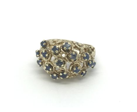 A circa 1950s 9ct gold dress ring set with sapphires, approx 7.1g and approx size K.