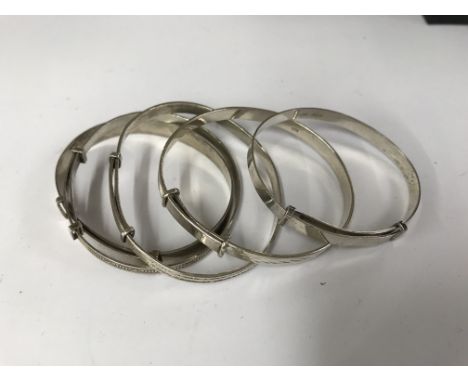 5 silver bangles