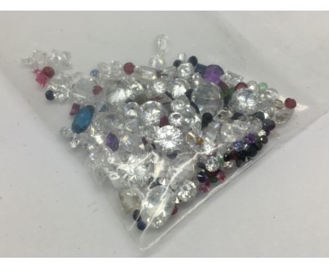 A bag of loose mixed stones including cubic zirconia, ruby, sapphire, amethyst and emerald 89.85ct