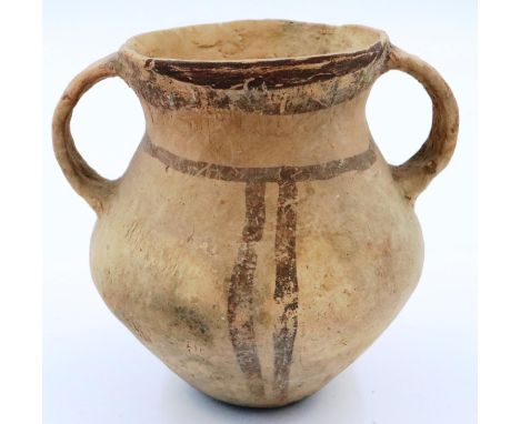 A Neolithic period vessel, twin handles and of urn form, with polychrome decoration, D: 12 cm, H: 12 cm. Losses to one handle