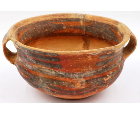 A Neolithic period terracotta bowl, having twin ring handles and flared rim, retaining most of its polychrome decoration, D: 