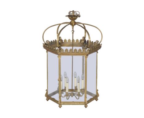 A substantial gilt metal and glazed six light hexagonal hall lantern, second half 20th century, the frame supports cast as fl