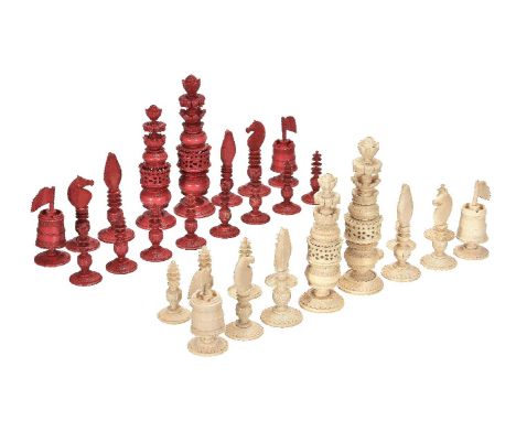 ϒA substantial Anglo-Colonial turned, carved and part stained ivory chess set, probably Burmese, first half 19th century, one