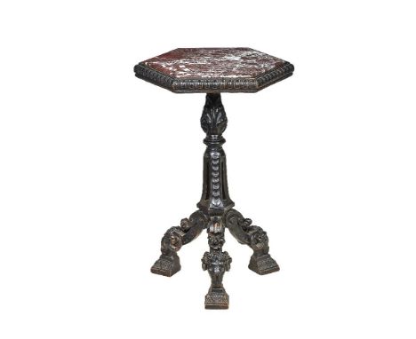 A carved and ebonised wood and marble mounted occasional table in Neoclassical style, late 19th century, the inset hexagonal 