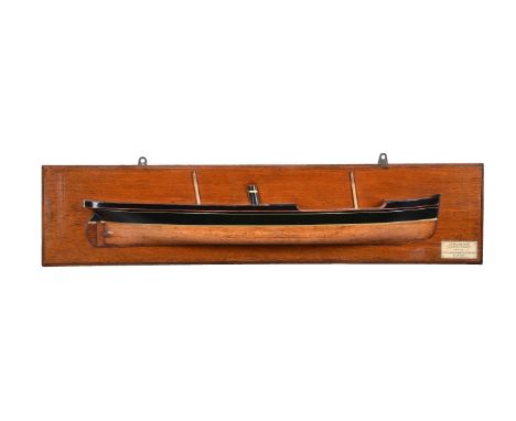 A half block model of the S.S. William Hinde, 20th century, with funnel and twin truncated masts, a painted plaque to the rec