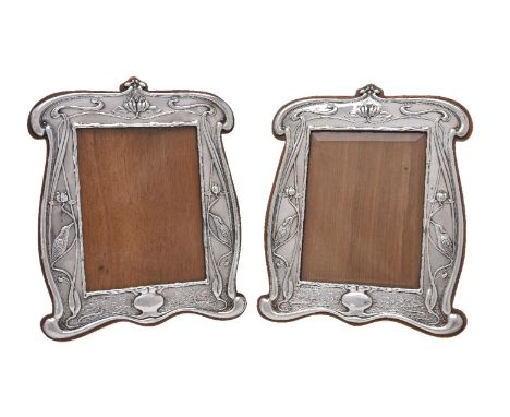 A pair of Arts and Crafts silver photograph frames by William Neale &amp; Son, Chester 1903, Rd. No. 412167, curved rectangul
