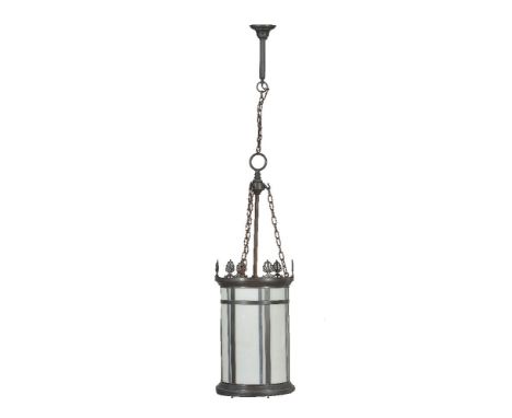 A metal and milk glass single light hall lantern, first half 20th century, of cylindrical form, the strapwork clad body mount