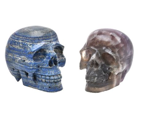 A carved fluorspar (fluorite) model of a human skull, second half 20th century, with pronounced and varying shades of purple,