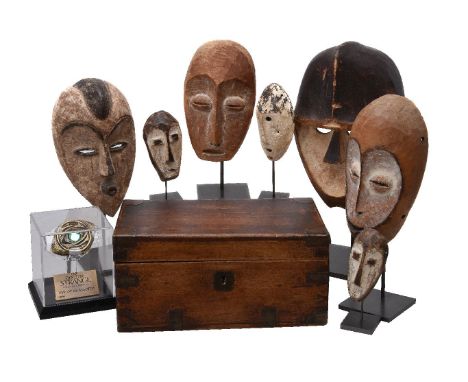 A group of seven carved and painted wood masks in the style of antique African tribal examples, second half 20th century, of 