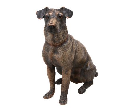 An Austrian painted terracotta model of a seated dog, first quarter 20th century, its head a little to sinister, with inset g