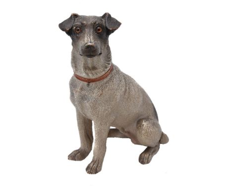An Austrian painted terracotta model of seated dog, first half 20th century, the head turned to sinister, with inset glass ey