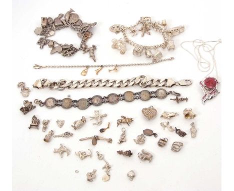A mixed lot of silver jewellery, to include a chunky curblink bracelet stamped 925, two charms bracelets, a quantity of loose