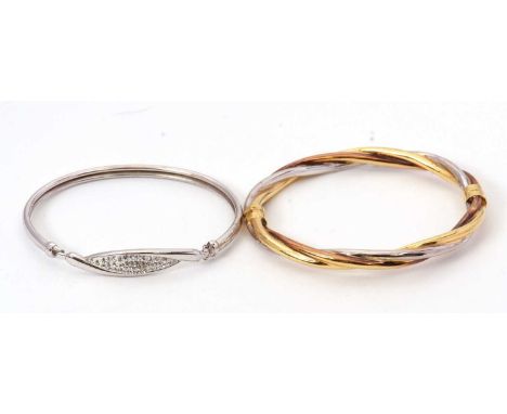 Two bangles: one tri-colour bangle stamped 9K, inner diameter 6cm, 9.3g, together with a bangle stamped 925 with crystal deco