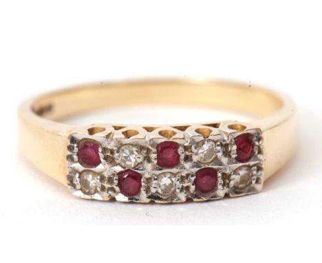 A 14ct ruby and diamond ring, set with alternating rubies and single cut diamonds in a chequerboard pattern, 14mm wide, with 