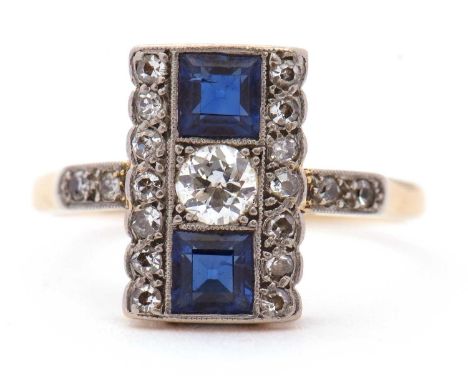 An Art Deco sapphire and diamond ring, with a central round old European cut diamond to centre with a square step cut sapphir