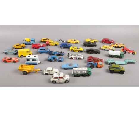 A quantity of die cast vehicles. Dinky toys Austin Cooper, Matchbox series No 15, Corgi Juniors steam roller etc  