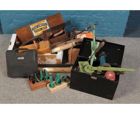 A large assortment of woodwork and metalwork tools, including T-squares, grinder, soldering iron and rods, trowels and a Blac