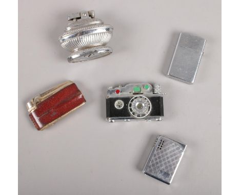 Five novelty lighters. KKP Photo Flash Cigarette Lighter in the form of a camera, Colibri molectric lighter, Ronson etc  