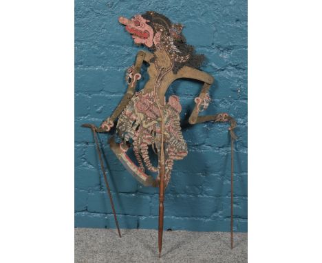 A Vintage Wayang Kulit Indonesian shadow puppet. Marked 'Darsasana'. 81cm length.  