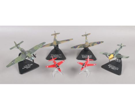 A collection of diecast aeroplanes on stands. Four Atlas Edition Battle of Britain and Dunkirk aeroplanes, along with two Cor