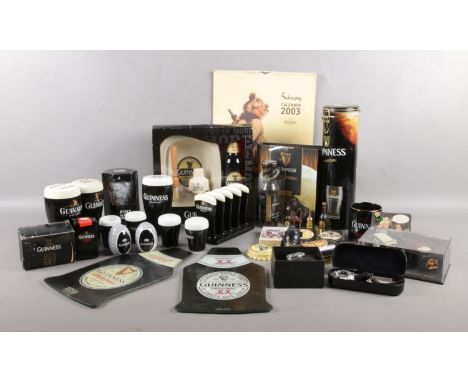 A quantity of assorted Guinness memorabilia. To include, toast rack, three ceramic beer money moneyboxes, condiment sets, pla