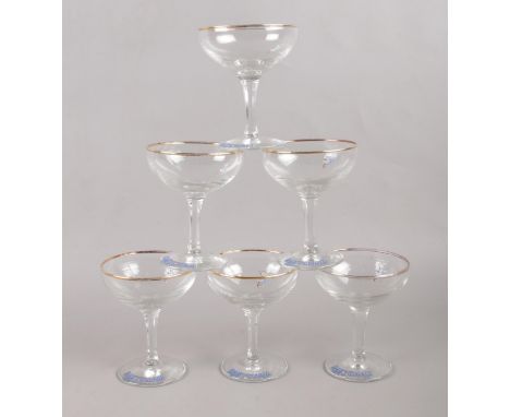A collection of six vintage retro Babycham coupe glasses. Comprising of having the Babycham print &amp; deer to the base. H: 