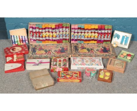 A box of vintage Christmas accessories. Including two boxes of Christmas crackers, box sets, etc.  