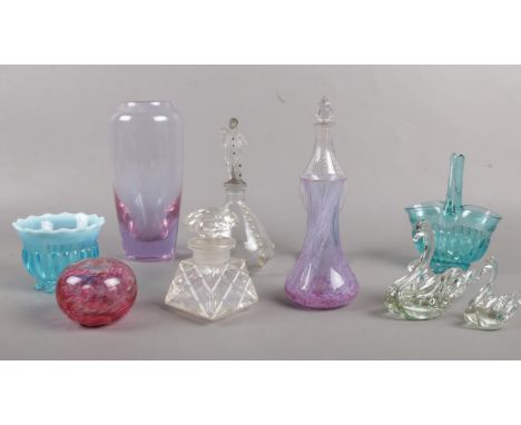 A quantity of glassware. Vintage perfume bottles, Caithness vase, swan paperweights etc  Chip on top of rim of largest vase