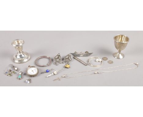 A collection of silver oddments. To include Swiss fob watch, Chester assayed egg cup and filled candlestick.  