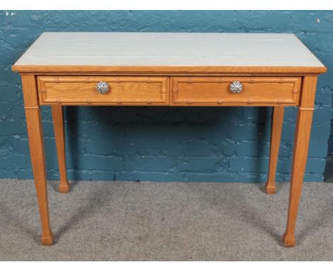 A pair of light oak side tables with painted top and single drawer along with matching table/desk.  