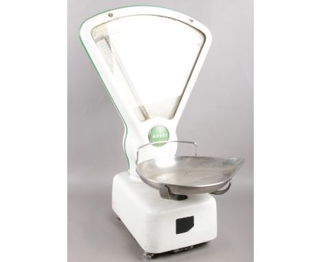 A set of Avery shop scales, decorated in white and green enamel, 50cm high.  