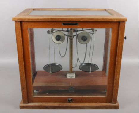 A cased set of Griffin &amp; Tatlock chemical scales. Cased WJ George Ltd.  Missing scale plates.