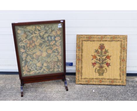 A wood framed embroidered fire screen and a decorative tapestry. [2]. [W]