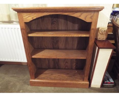 A light oak Bookcase measuring 112 cm (h) x 92 cm (w) x 33 cm (d)