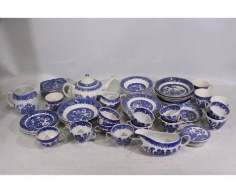 Wood and Sons, Swinnertons, Ridgway, Johnson Bros - A quantity of blue and white ceramic tea wares in the 'Willow' pattern - 