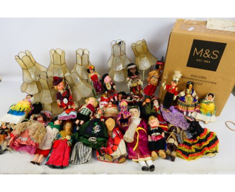 A quantity of international costume dolls and a box of light shades. [3]. [W]