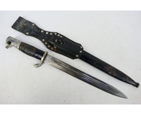 A WWII (World War Two) German bayonet with makers marks Christian Solingen inscribed to the base of the blade. Comes with bla