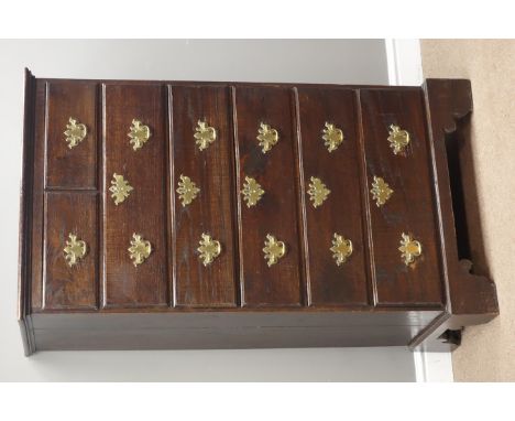 17th century style oak chest, two short and five long drawers, on bracket feet, W77cm, H138cm, D45cm Condition Report Click h