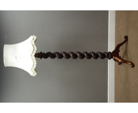 Carved walnut standard lamp with shade (H150cm (excluding fitting)), and an oval framed bevelled edge mirror Condition Report