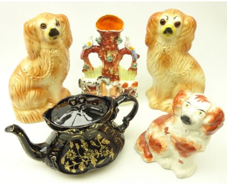 Pair of Staffordshire dogs with glass eyes, another Staffordshire dog, Staffordshire flatback group and a Jackfield type teap