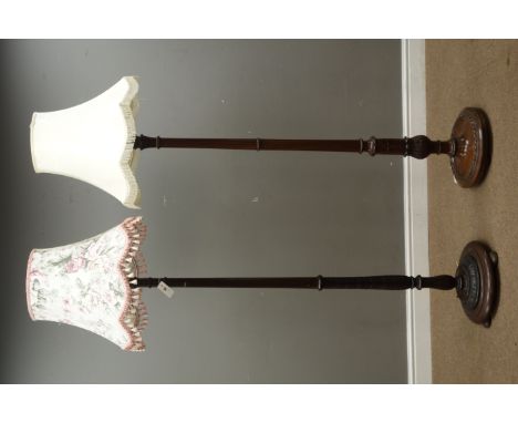 20th century walnut acanthus carved standard lamp on stepped circular base and another 20th century walnut reeded standard la