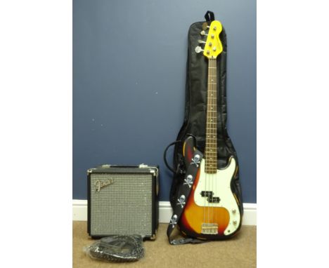 'Vintage Icon Series' bass guitar with distressed style finish, with soft case and a Fender Rumble 15 bass amp, new with tags