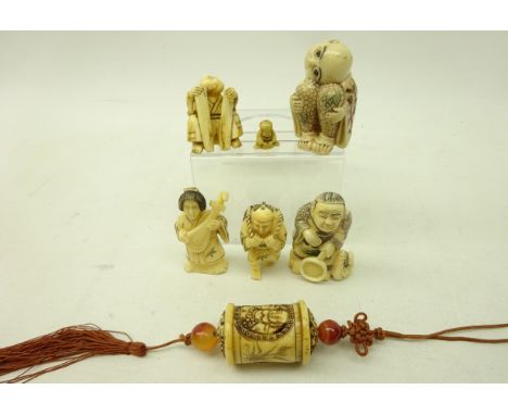 Four Japanese ivory style resin Netsukes, seated figure Netsuke, probably bone, miniature figural bead & Japanese cylindrical