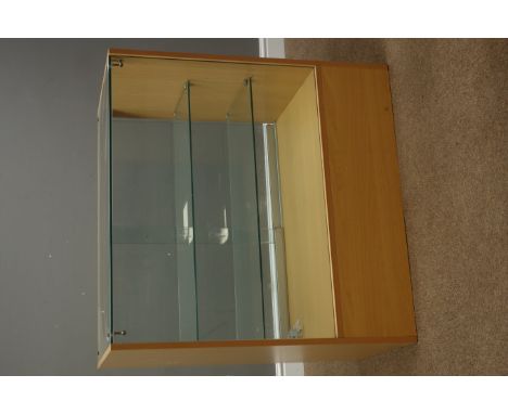 Light wood and glazed shops display cabinet enclosed by sliding glass doors, with two glass shelves and drawer, W91cm, H91cm,