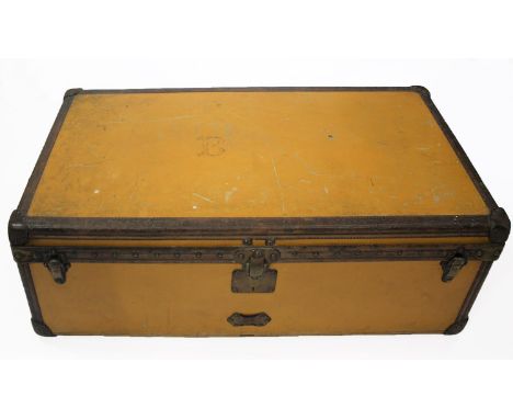 VINTAGE LOUIS VUITTON TRUNK a vintage wooden and yellow canvas trunk with brass lock plate and catches, the lid with brass st