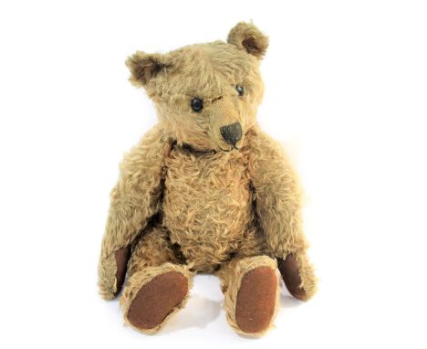 EARLY STEIFF TEDDY BEAR circa 1908-1915, with black boot button eyes and stitched mouth and nose, with a mohair body with som