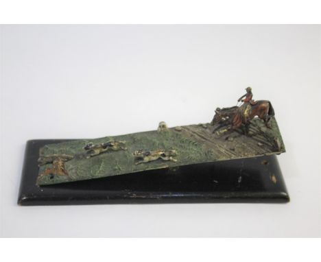 COLD PAINTED HUNTING DESK TIDY a large metal clip on a spring, mounted with a horse and rider jumping a gate, and hounds hunt